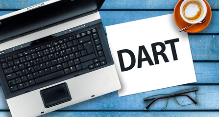 Dart Programming Language.  Word Dart on paper and laptop 