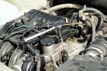 The engine is from the car and the key is a ratchet with a head.