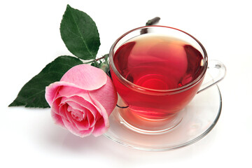 mug with tea and a pink rose on a white background