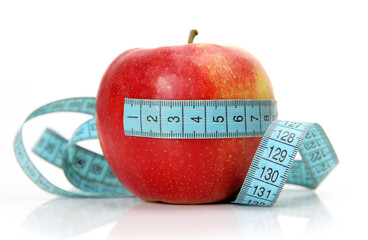 ripe apple and measuring tape