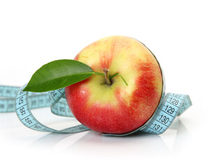 ripe apple and measuring tape