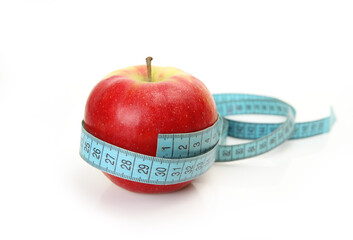 ripe apple and measuring tape