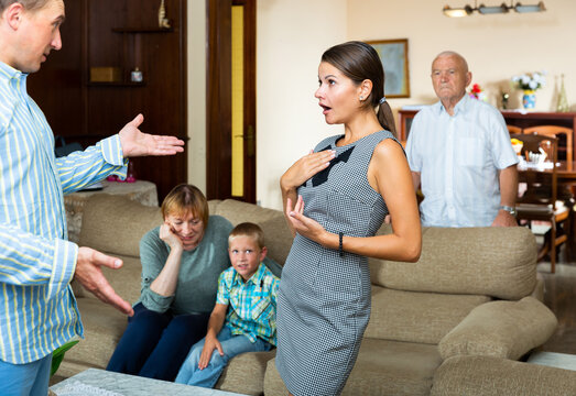 Quarrel between husband and wife in a large family. High quality photo