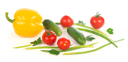 cucumbers, peppers, tomatoes and green onions isolated on white background
