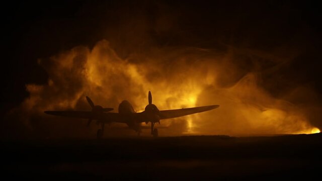 German Junker (Ju-88) night bomber at night. Artwork decoration with scale model of jet-propelled plane in possession. Toned foggy background with light. War scene. Selective focus