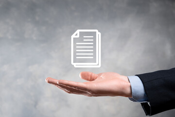 Hand holding a document icon in his hand Document Management Data System Business Internet...