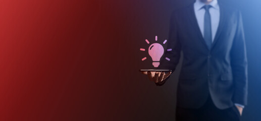 Hand holding light bulb. Smart idea icon isolated. Innovation, solution icon. Energy solutions. Power ideas concept. Electric lamp, technology invention. Human palm. Business inspiration.
