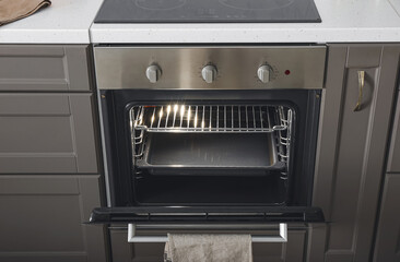 Open oven in modern kitchen
