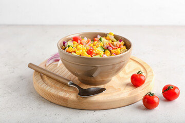 Composition with tasty quinoa salad on light background