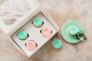 Composition with tasty cupcakes on grunge background