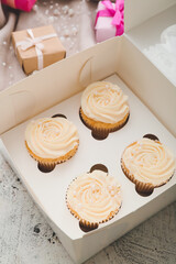 Composition with tasty cupcakes on light background
