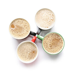 Cups of tasty coffee on white background