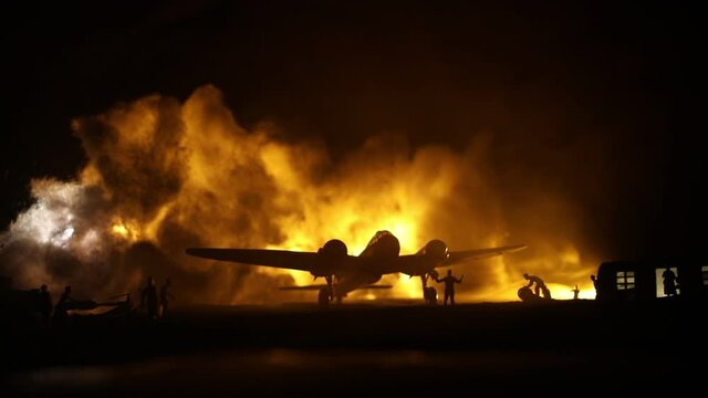 German Junker (Ju-88) night bomber at night. Artwork decoration with scale model of jet-propelled plane in possession. Toned foggy background with light. War scene. Selective focus