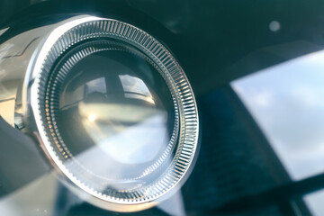 detail of modern car projector headlight, shallow depth of field, filter effect