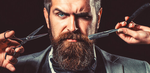 Bearded client visiting barber shop. Barber scissors and straight razor, barber shop, suit. Vintage...
