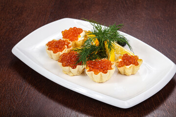 Red caviar canape served dill