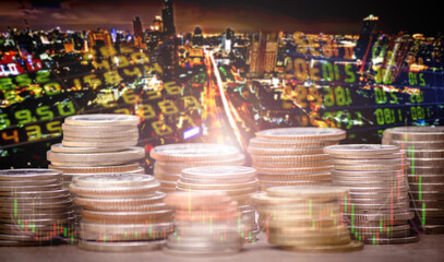 Financial investment concept, Double exposure of city night and stack of coins for finance investor, Forex trading candlestick chart economic , ECN Digital economy, technology, Industry.