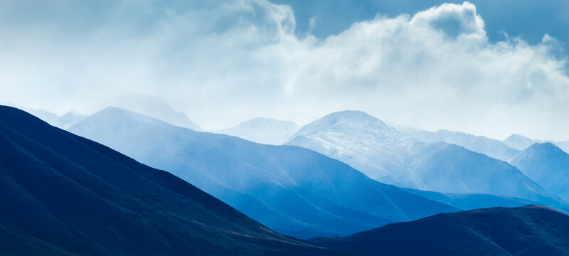 Rolling Ben Ohau Range in the mist, Twizel, South Island