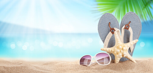 Flip flops on sunny sea beach with copy space