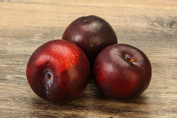 Ripe sweet plum fruit heap