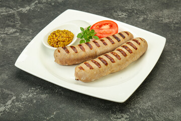 Grilled natural pork sausages with sauce