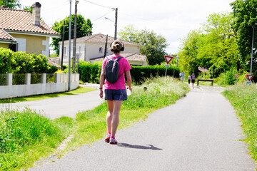 Fototapeta na wymiar Woman exercise walking rear view sport in city park