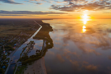 Sunset aerial view of Beloye lake, Belozersky canal and Belozersk. Vologda Oblast, Russia.