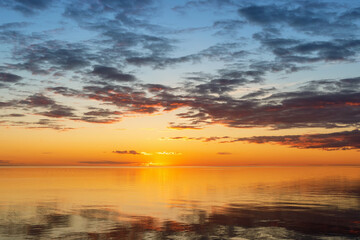 Fototapeta na wymiar Sunset on Beloye lake on quiet summer evening. Belozersk, Vologda Oblast, Russia.