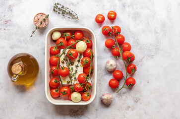 Preparing to bake feta cheese with tomatoes, capers, garlic, herbs, and olive oil. In the oven it turns into an amazing sauce by itself. Just add some cooked pasta, mix, and enjoy. 