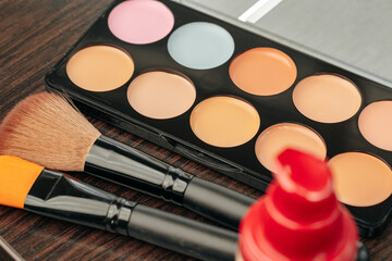 Make up products on vanity table close up