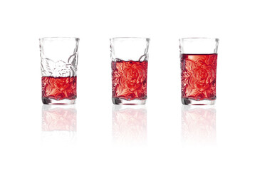 whiskey in shot glass on white background