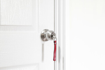 Installing locking knob with key at the door inside the home