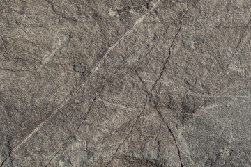 Fototapeta na wymiar Stone texture with cracks. Natural surface