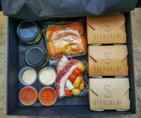 Gift set of a prepared meals in a box to take away during a quarantine. Translation: miracles