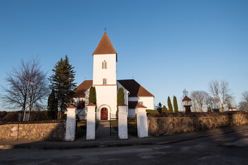 Alsunga catholic chursh in sunny spring evening, Latvia.