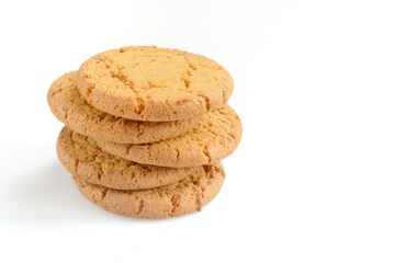 five pieces of oatmeal cookies lie on top of each other isolated on white background