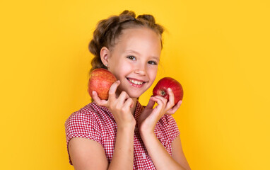Fototapeta na wymiar happy teen child with apples full of vitamin picked from autumn harvest, natural food
