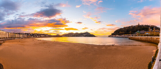 Panoramic at sunset on the beautiful beach of La Concha in the city of San Sebastian, in the...