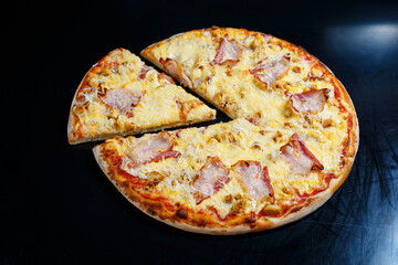 Chicken breasts with creamy sauce and grated cheese on a pizza. tasty fresh pizza on a thick crust with meat
