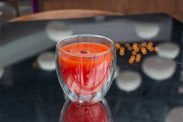 Raspberry tea in a glass in a restaurant.