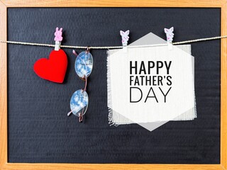 Happy Father's day card idea, Red heart with eyeglass and canvas fabric over black background