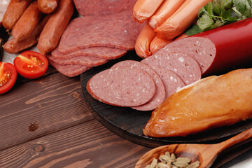 Variety of meat and sausage products on table