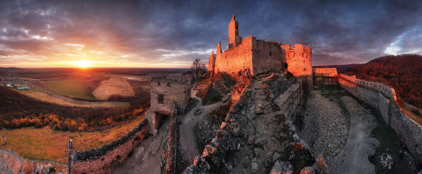 Ruin of castle Plavecky in Slovakia - Panorama of dramatic sunset