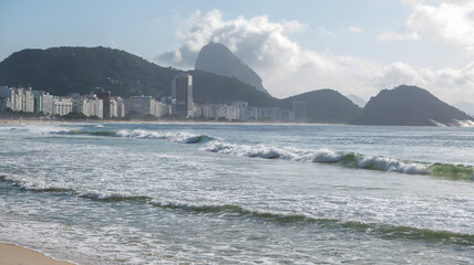 Ocean surf on the beach of Copacabana. Rio de Janeiro, February 2020