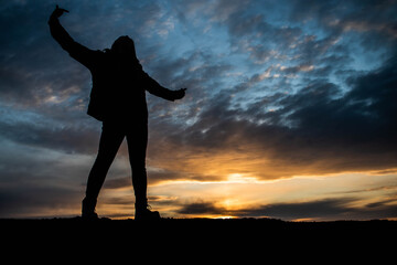 silhouette of a girl at sunset