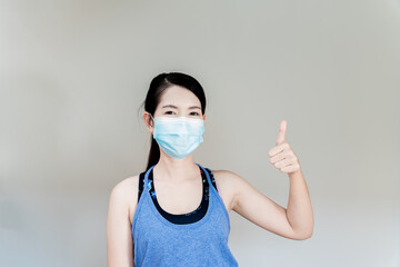 Woman wearing an anti virus protection mask to prevent others from corona COVID-19 She raised her...