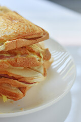 Toast on a white plate on a white background