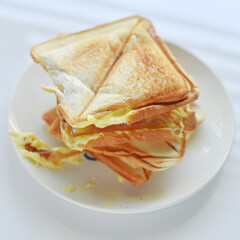 Toast on a white plate on a white background