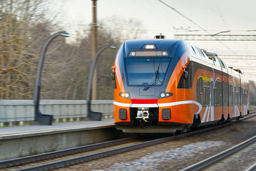 Express orange train. Estonian new train. ecological passenger transport, Fast Light Intercity and Regional Train.