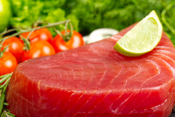 fresh raw yellowfin sliced tuna steak texture close-up. bluefin tuna medallions with lime
